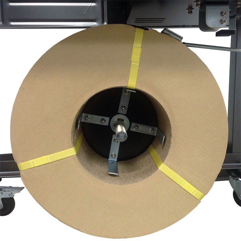 Large cardboard roll mounted on metal spindle