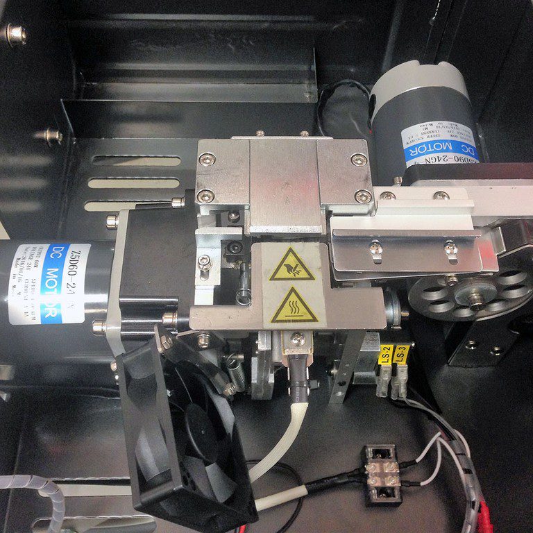 Metal motor and gear assembly with warning labels