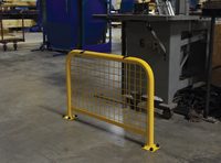 Yellow safety barrier with wire mesh in industrial setting.