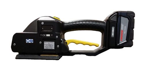 Close-up of a handheld power tool with a black handle and yellow trigger.