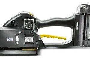 Close-up of a black and yellow handheld plastic tool with a trigger handle.