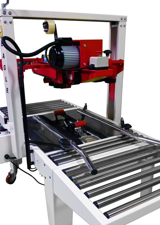 Close-up of red tape head on conveyor