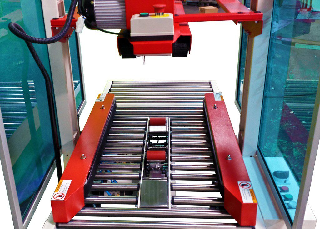 Red-framed roller conveyor with sensor head