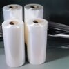Four rolls of white paper on tabletop