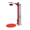Industrial machine with red arm and round platform